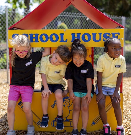 After school daycare children playing on playground.